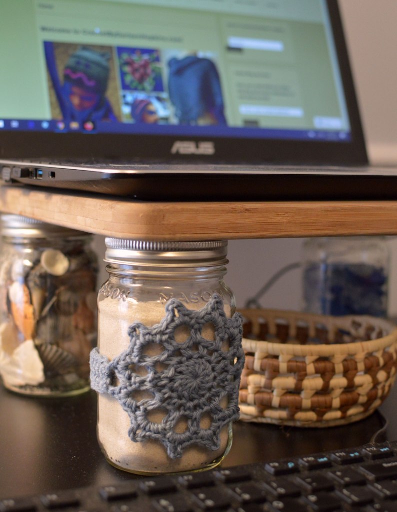 DIY laptop stand made with mason jars and cutting board